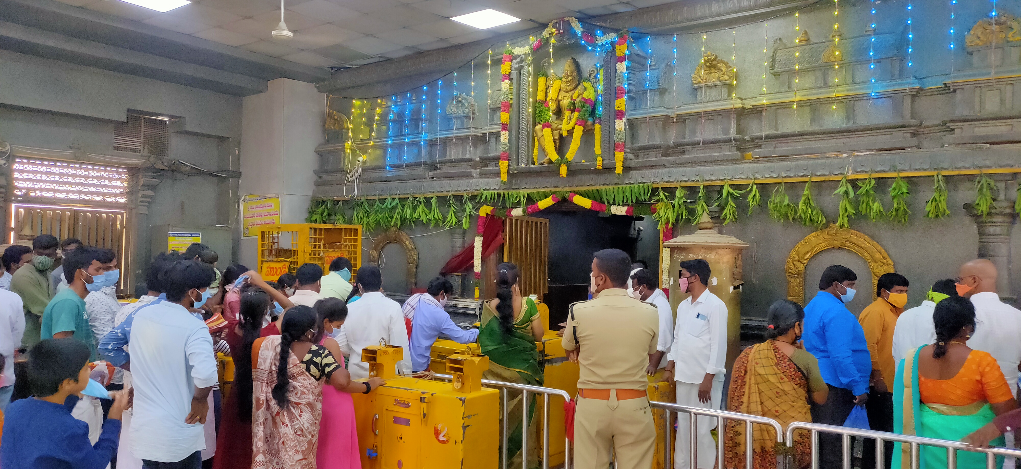 venerations with one lakh flowers to lord lakshmi narasimha swamy