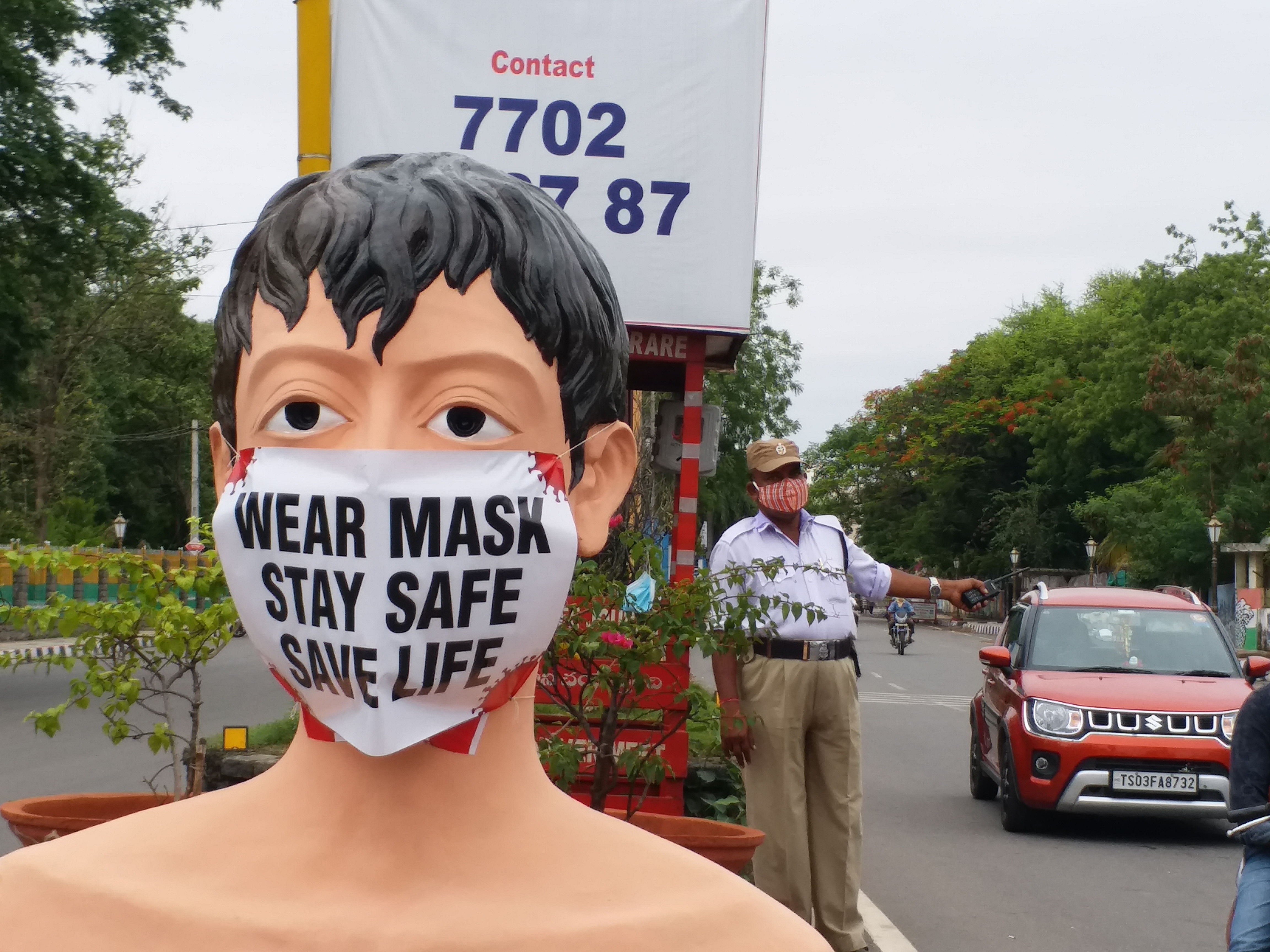 mask man statue in warangal district