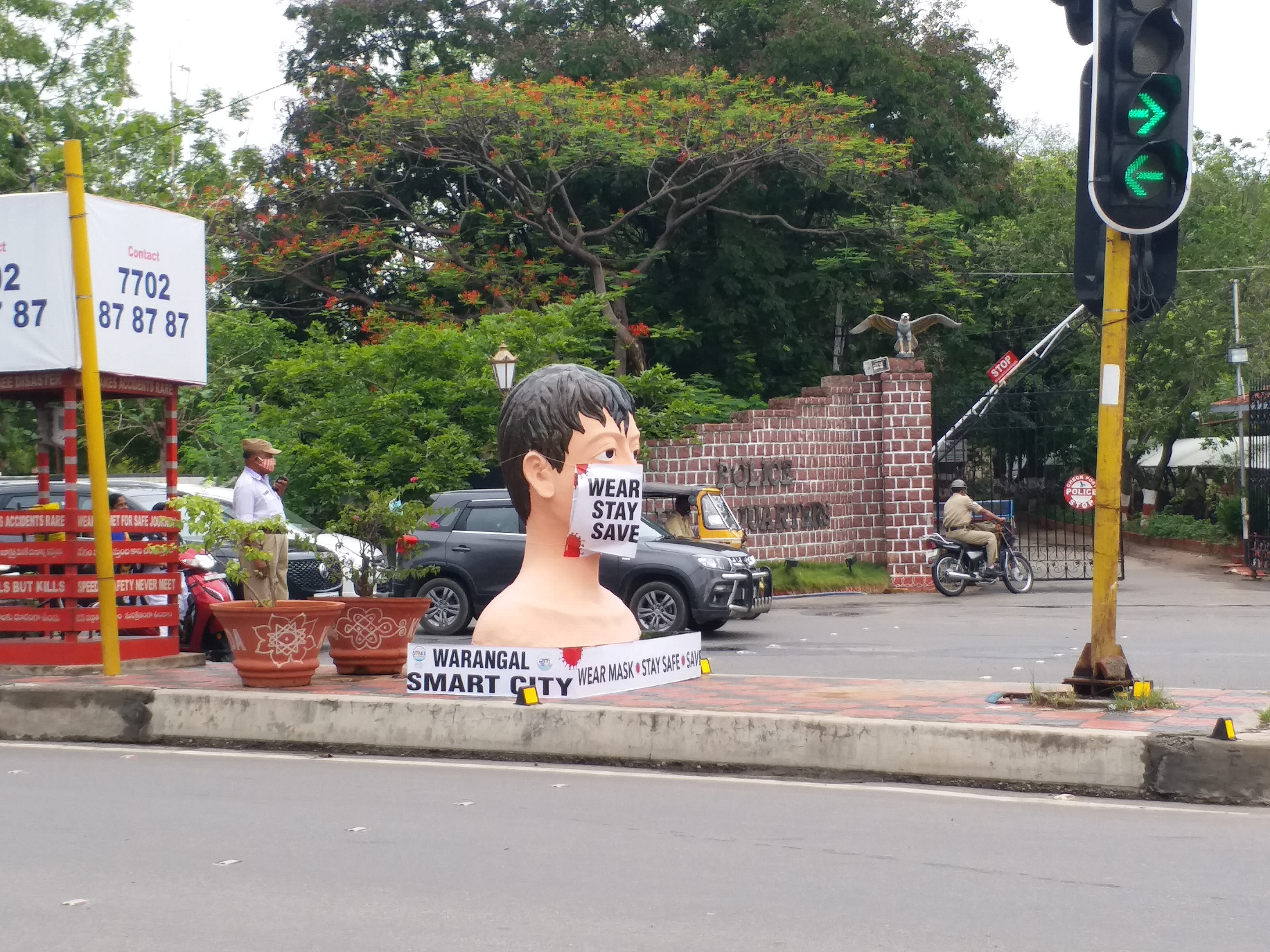 mask man statue in warangal district