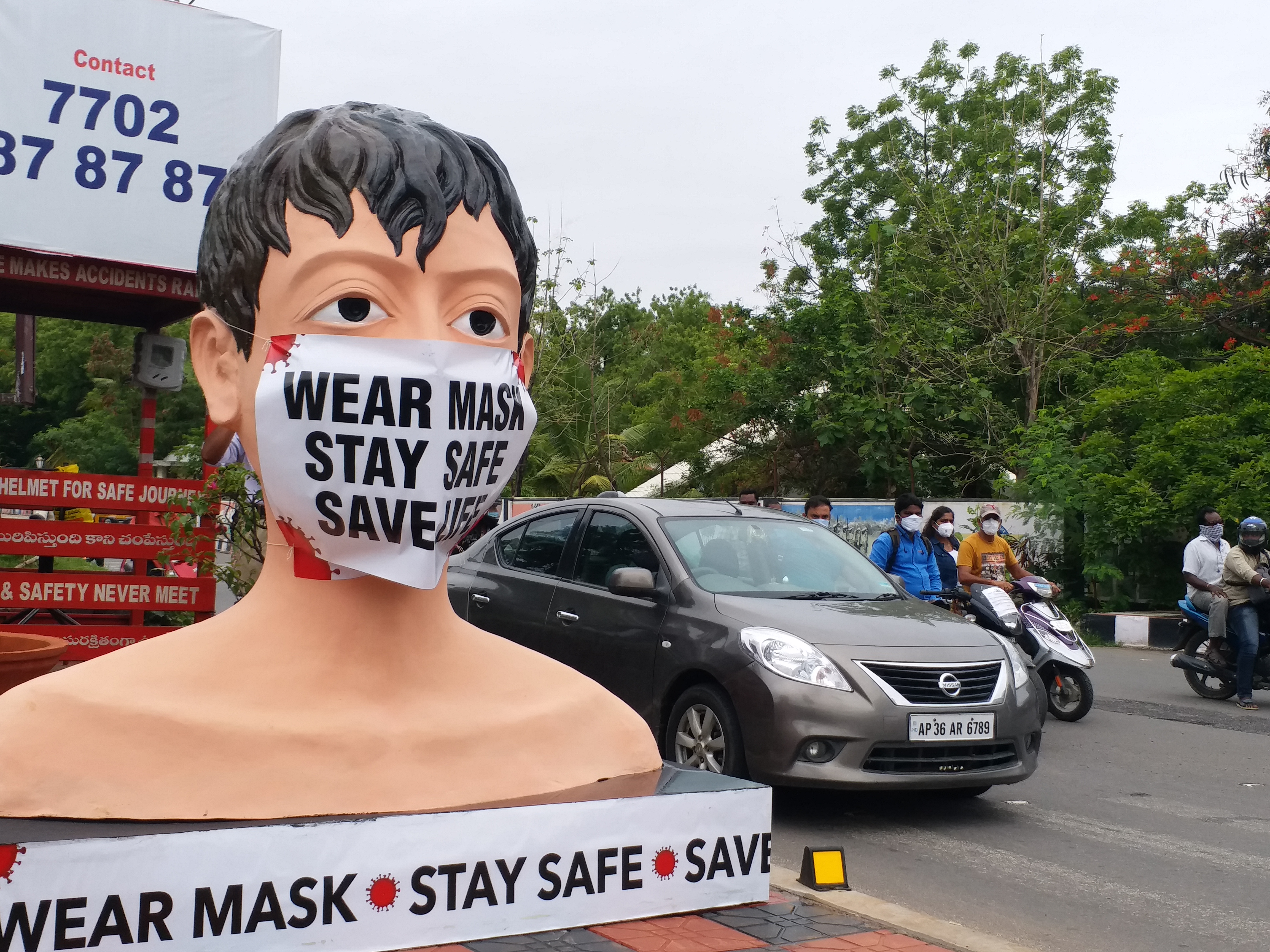 mask man statue in warangal district