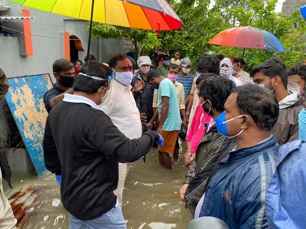 Minister inspecting submerged colonies in warangal district