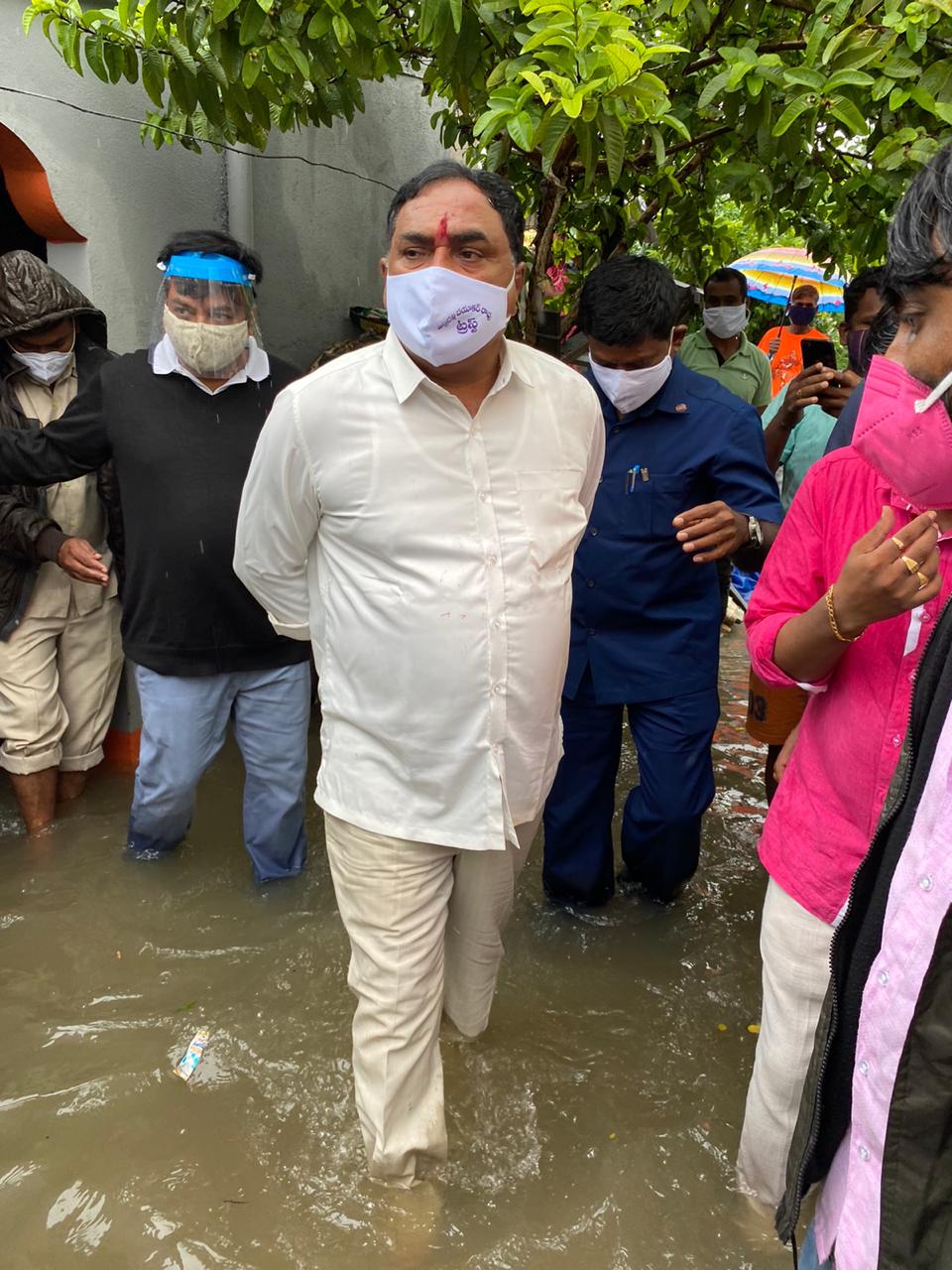 Minister inspecting submerged colonies in warangal district