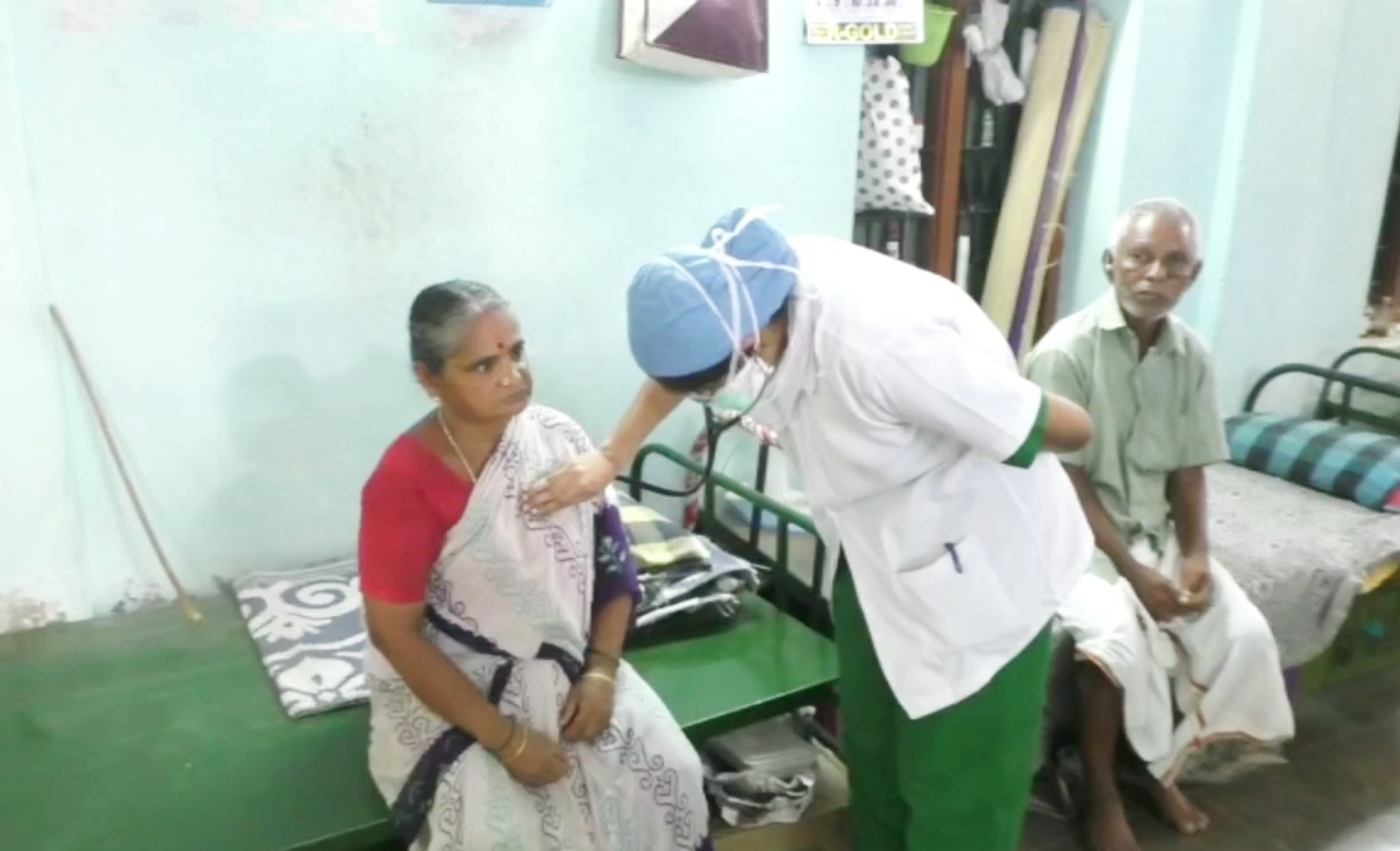 woman doctor goes home doorstep and rendering medical services