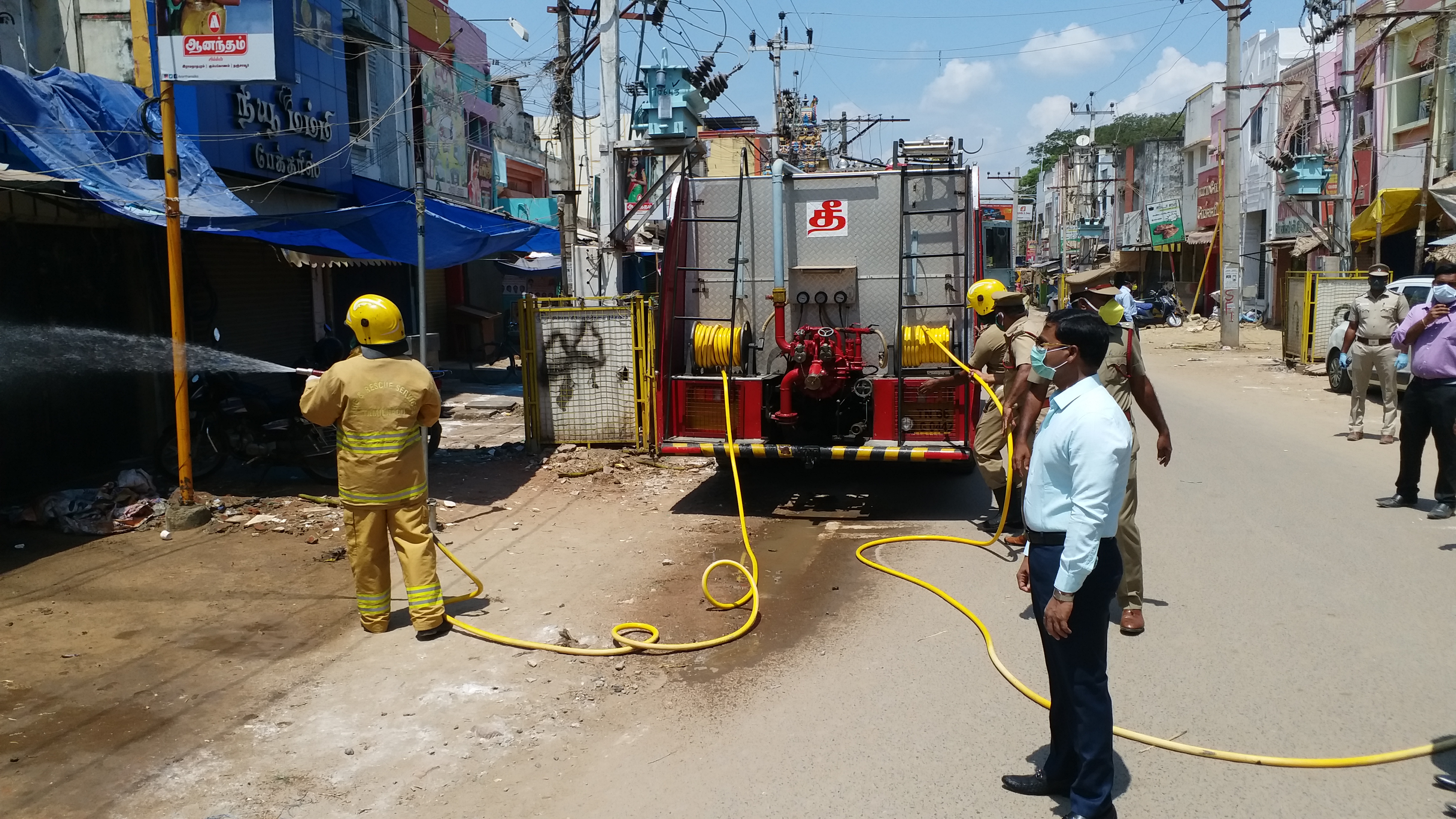 ramnad collector inspects sanitation spray work at market place