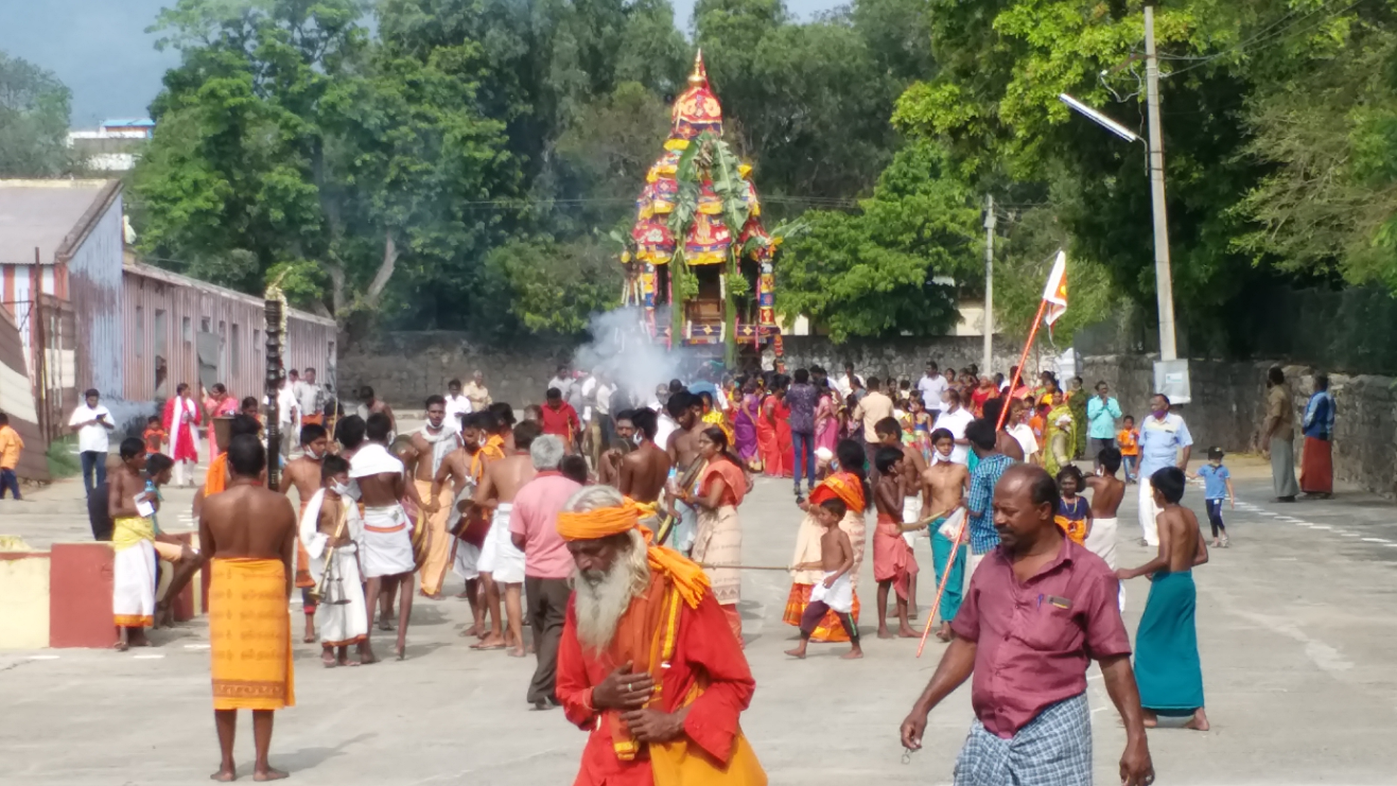 devotees take part in the procession of the Courtalieeshwarar temple car Festival