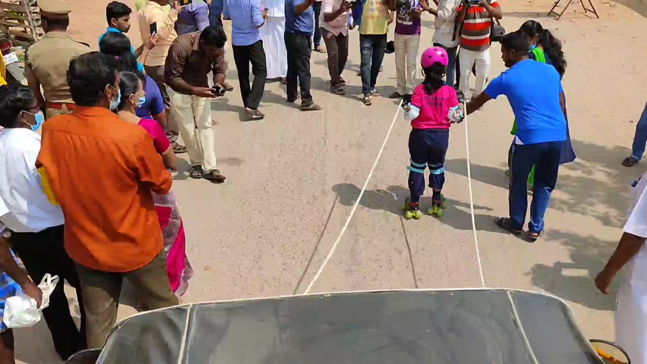 Six year old girl pulls auto by wearing skate roller urging 100 percent voting