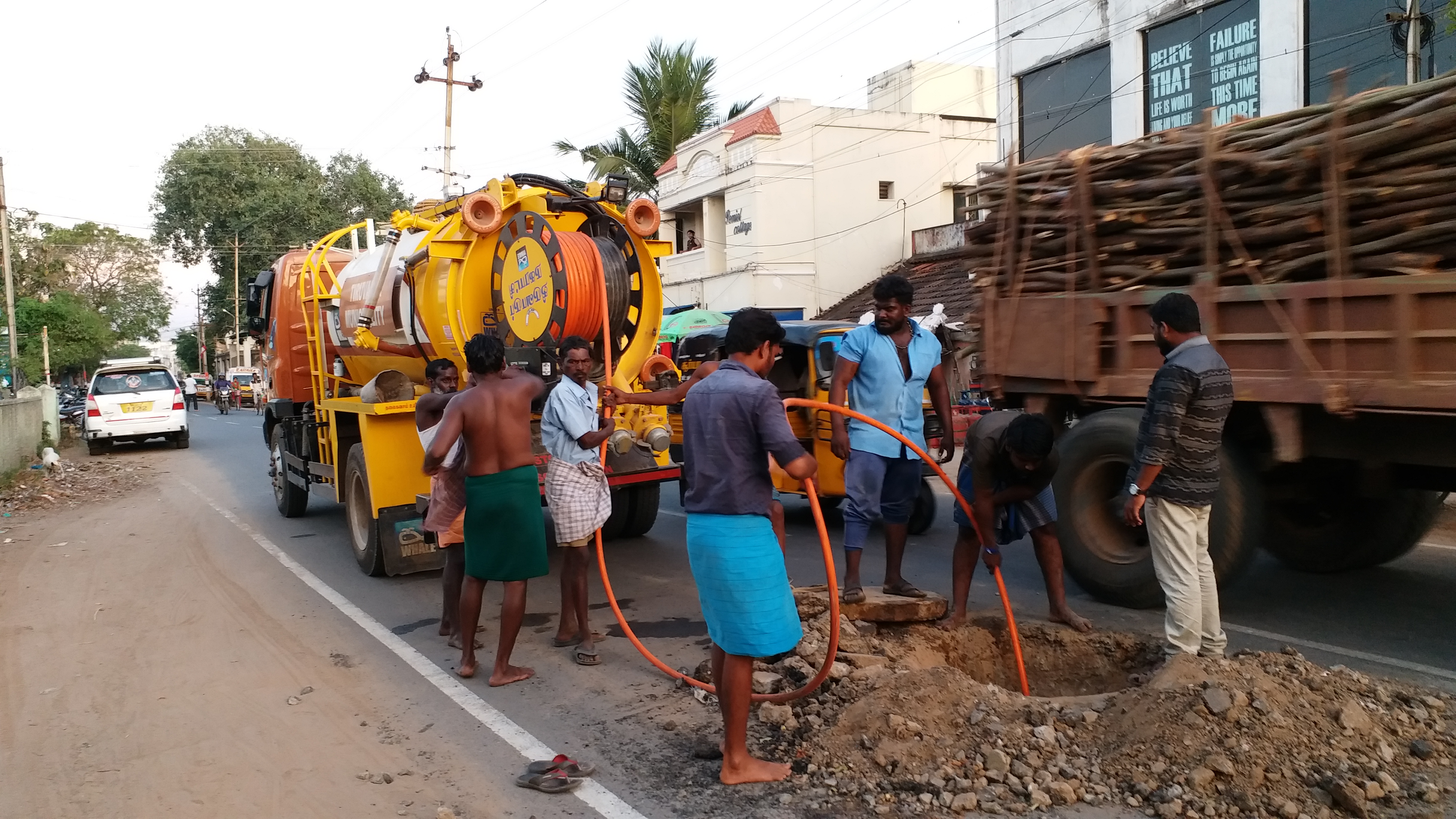 municipal workers repair at drainage system