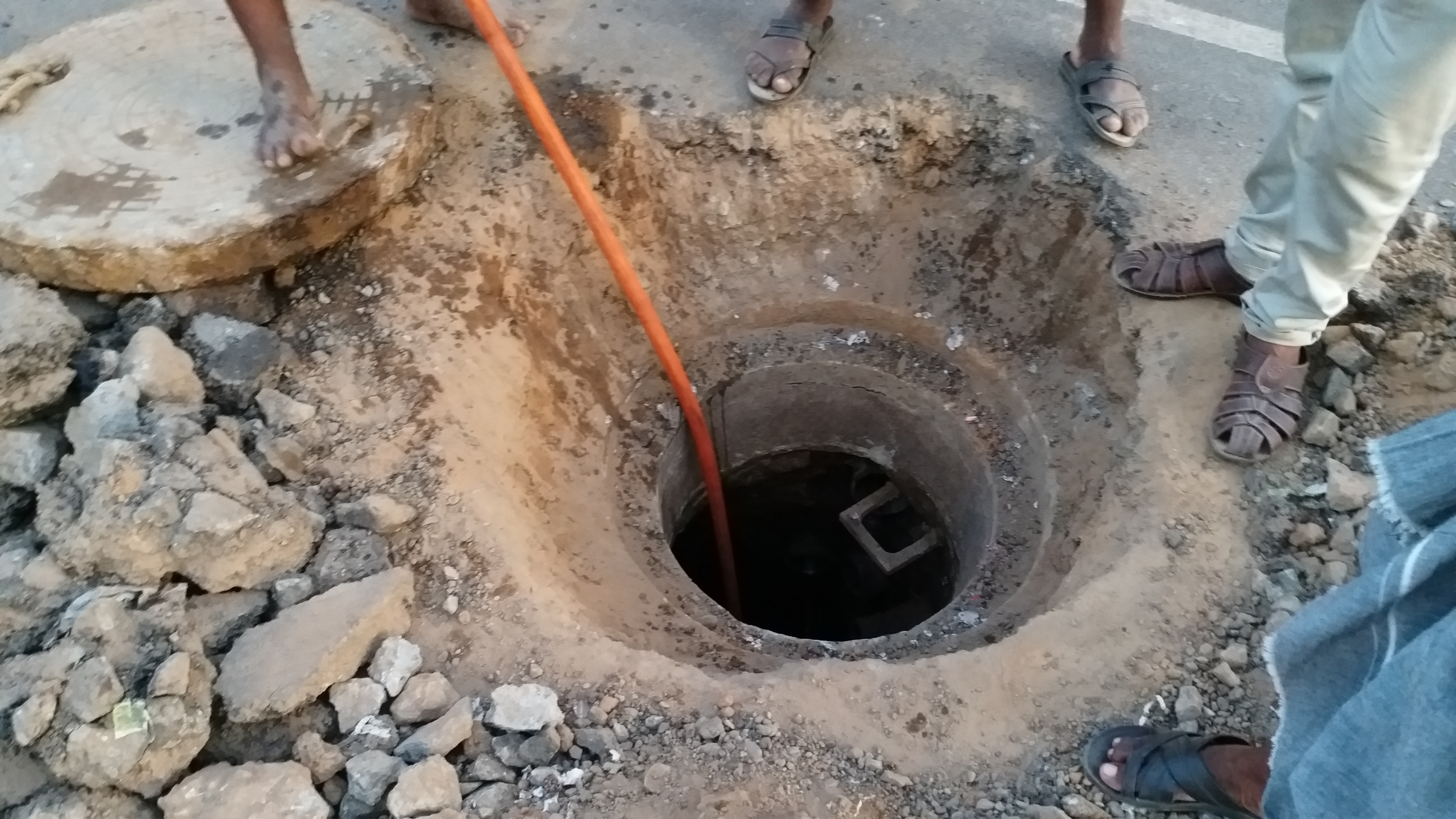 municipal workers repair at drainage system