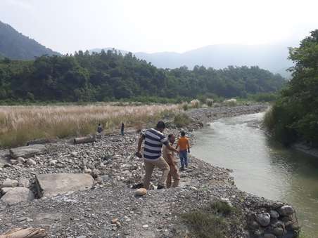 student flowing in the Yamuna River i