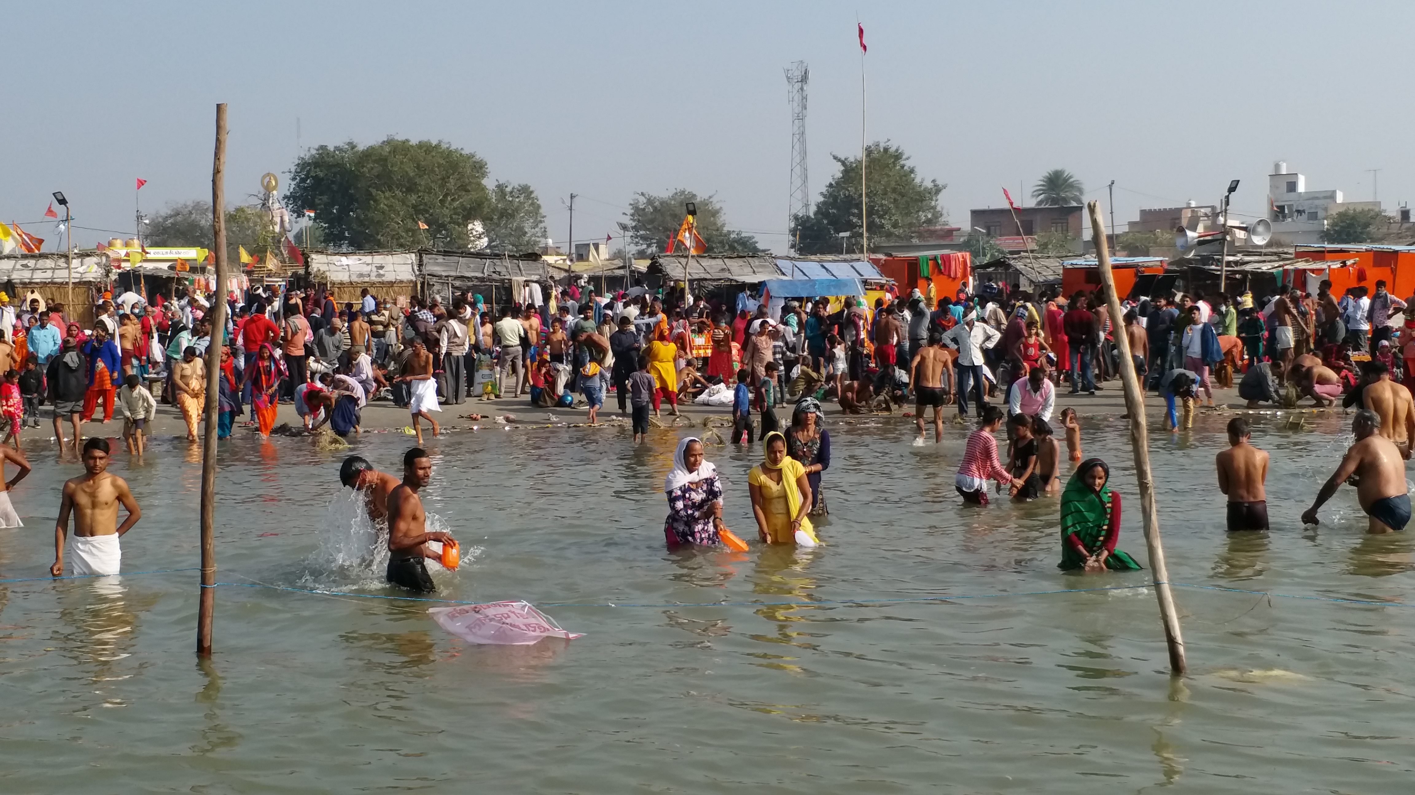 devotees gathered on bank of ganga in amroha