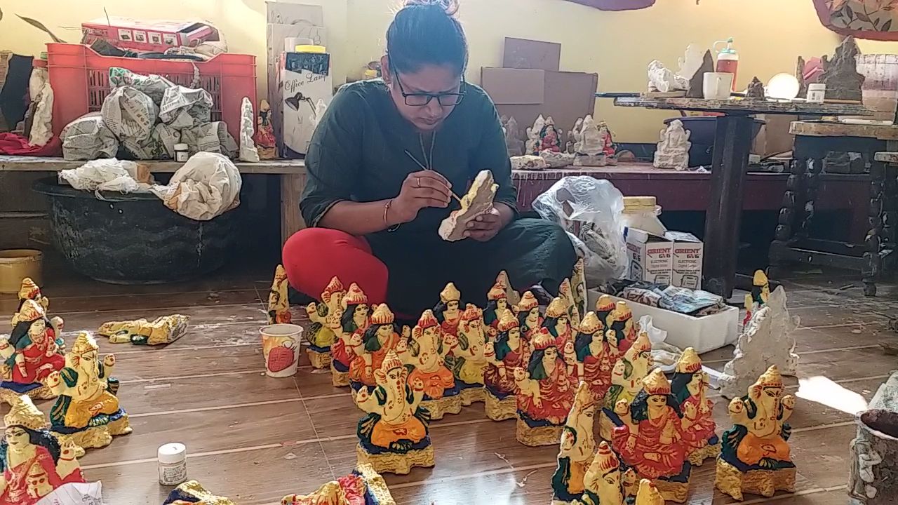 Laxmi-Ganesh being made from cow dung