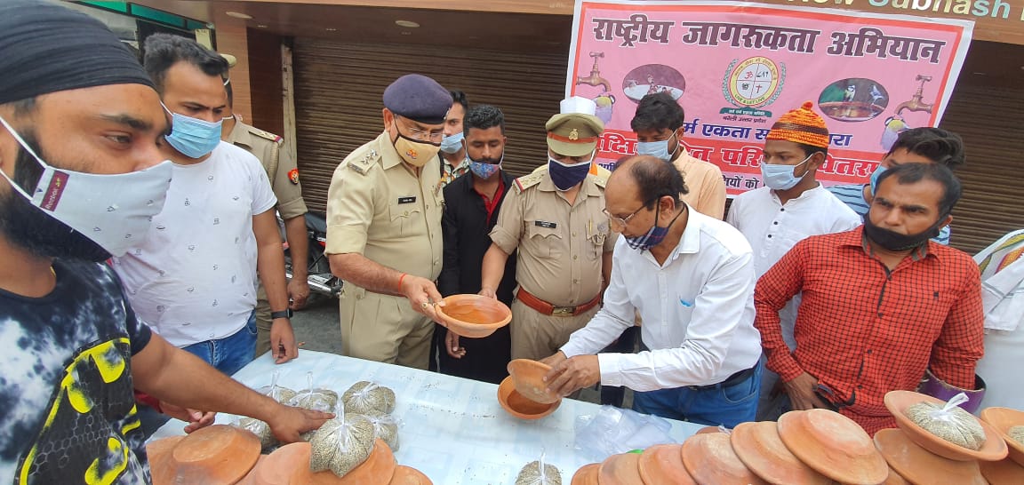 jan seva team distributed clay pots and mask for public in bareilly