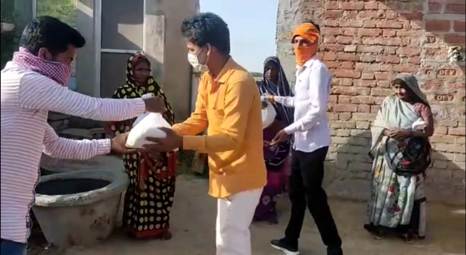 youth providing food to needy people