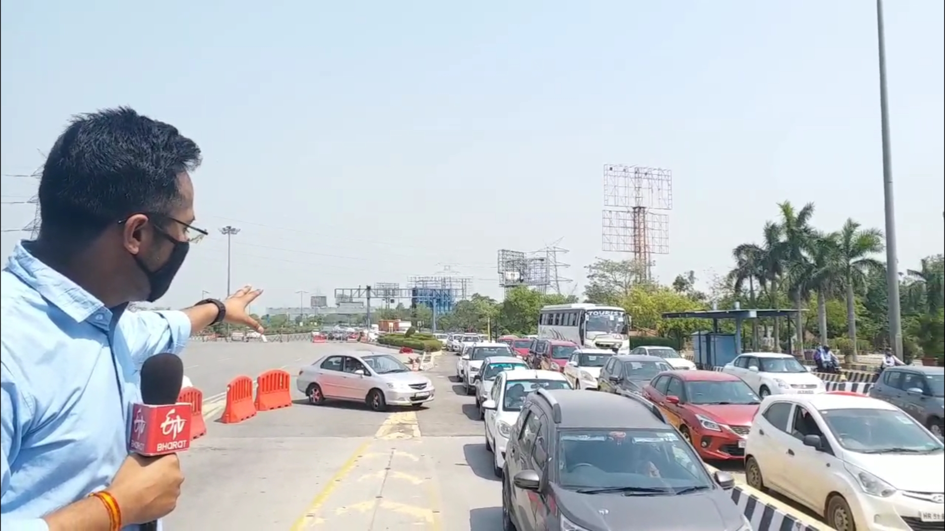 Policemen checking on Noida DND flyover jam with face shield mask and gloves corona virus