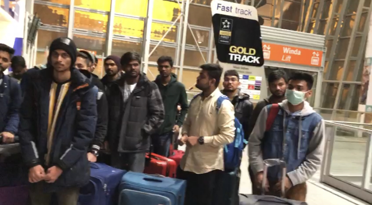 Indian people stranded at the airport in Poland