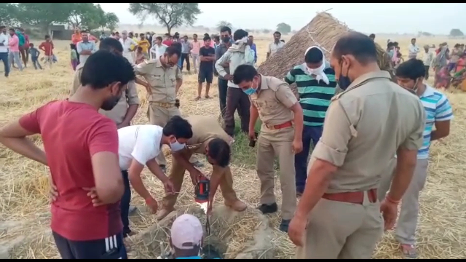 police firefighters and villagers gathered