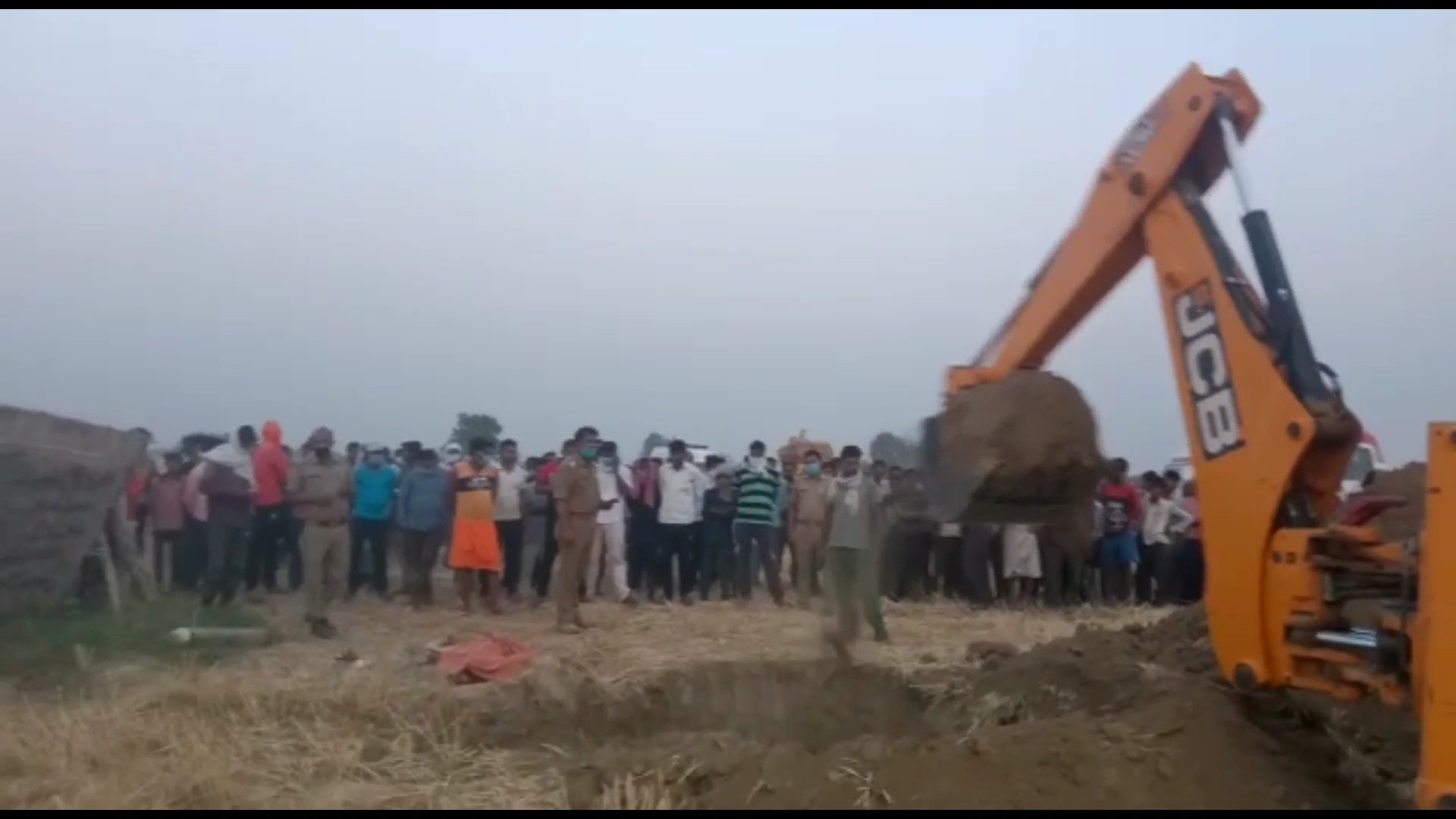 police firefighters and villagers gathered