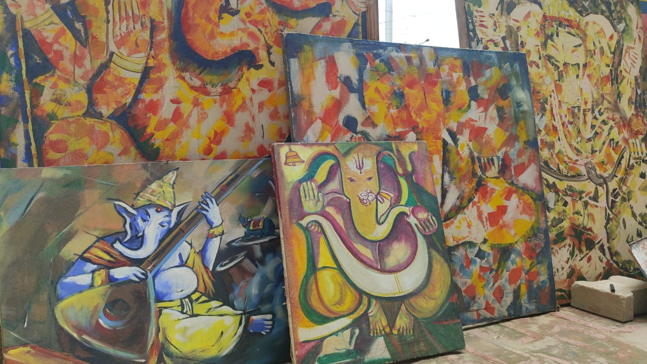 devotee of ganapati in varanasi prepares bappa painting in closed eyes