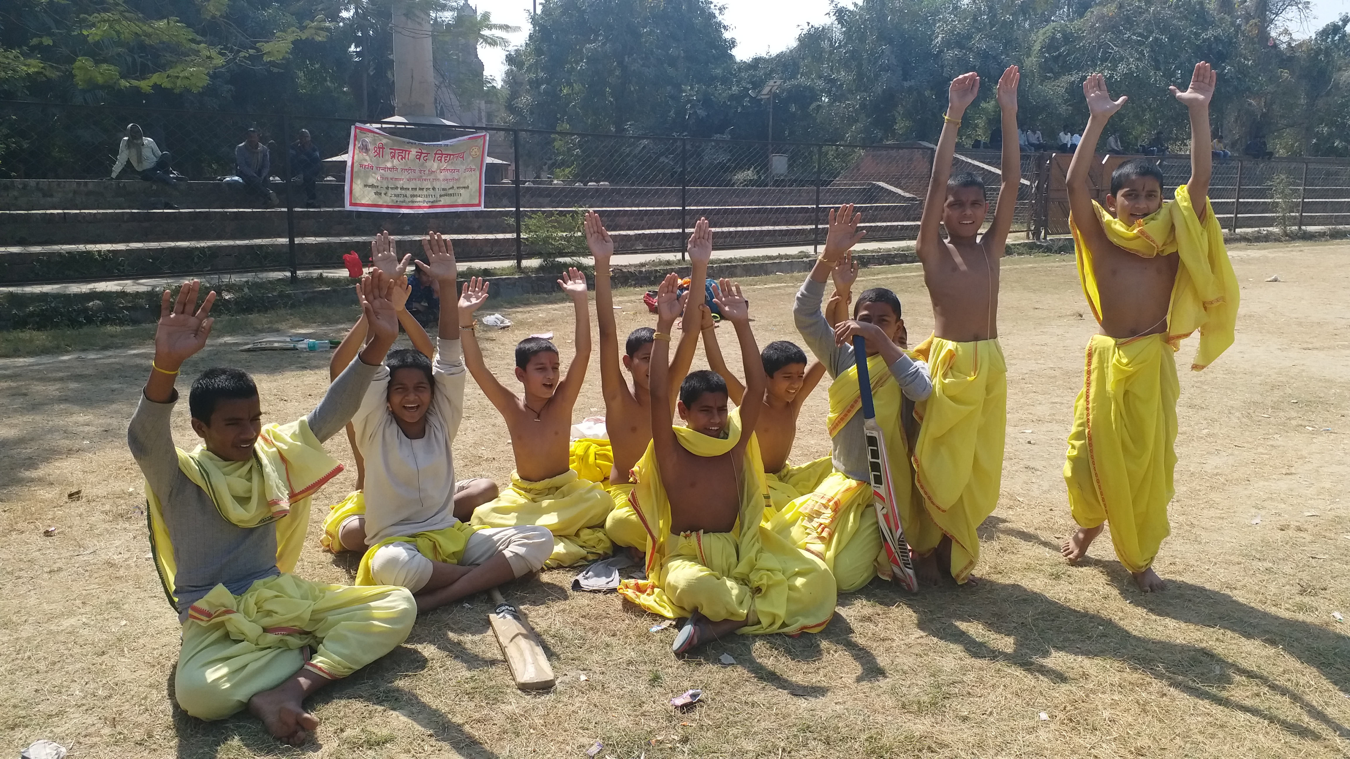 students playing cricket with sankrit comentry by wearing dhoti kurta in baranasi