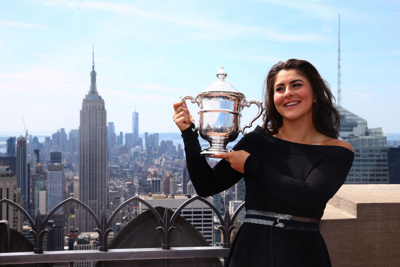 Bianca Andreescu poses for photographs after winning her maiden Grand Slam title.