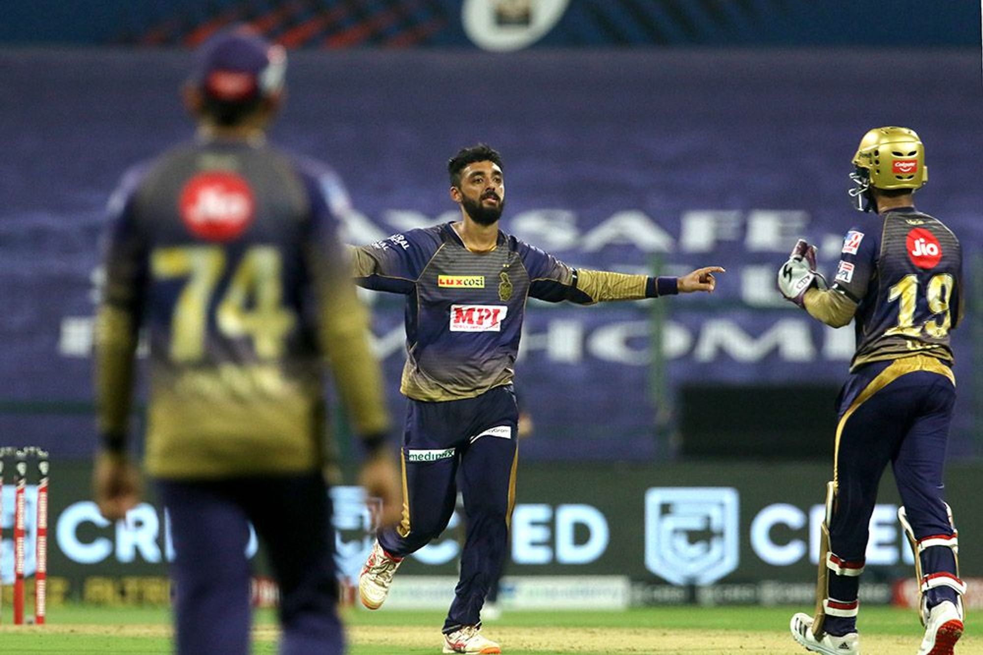 Varun Chakaravarthy of Kolkata Knight Riders celebrates the wicket of David Warner.