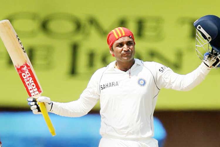 Sehwag acknowledges the support of fans at M. A. Chidambaram Stadium after hitting his 2nd triple ton.