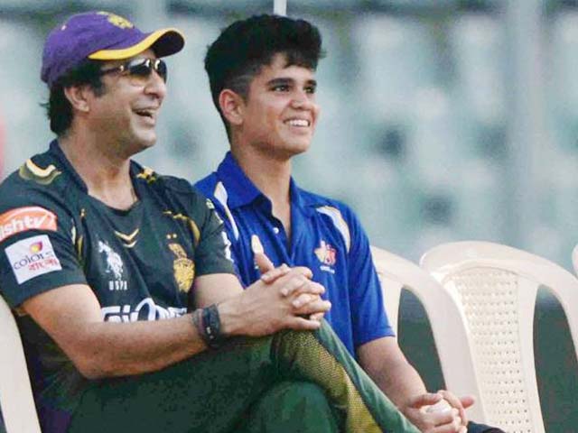 A young Arjun Tendulkar taking tips from legendary Wasim Akram, who was then KKR bowling coach.