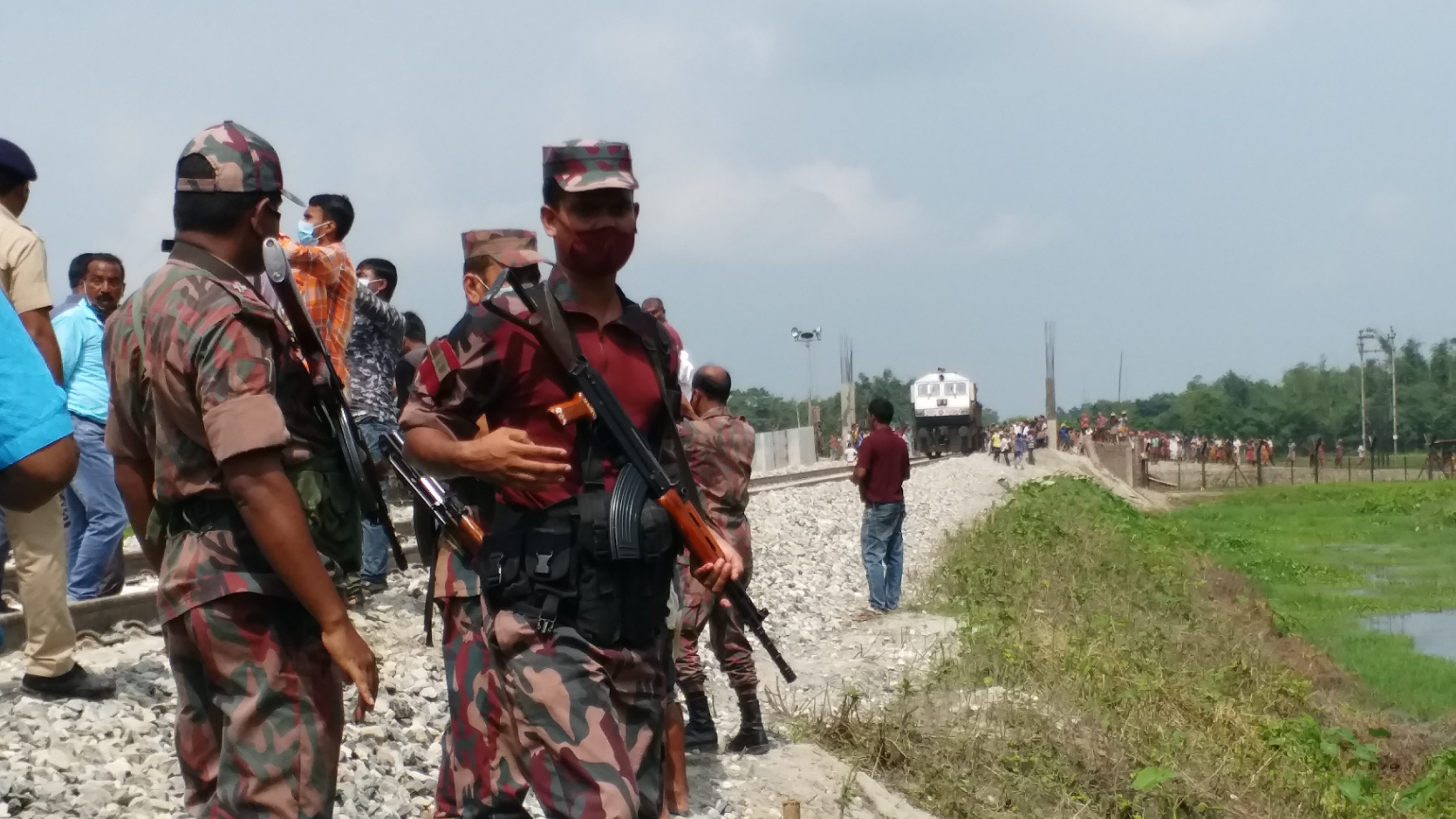 Security personnel near the rail line