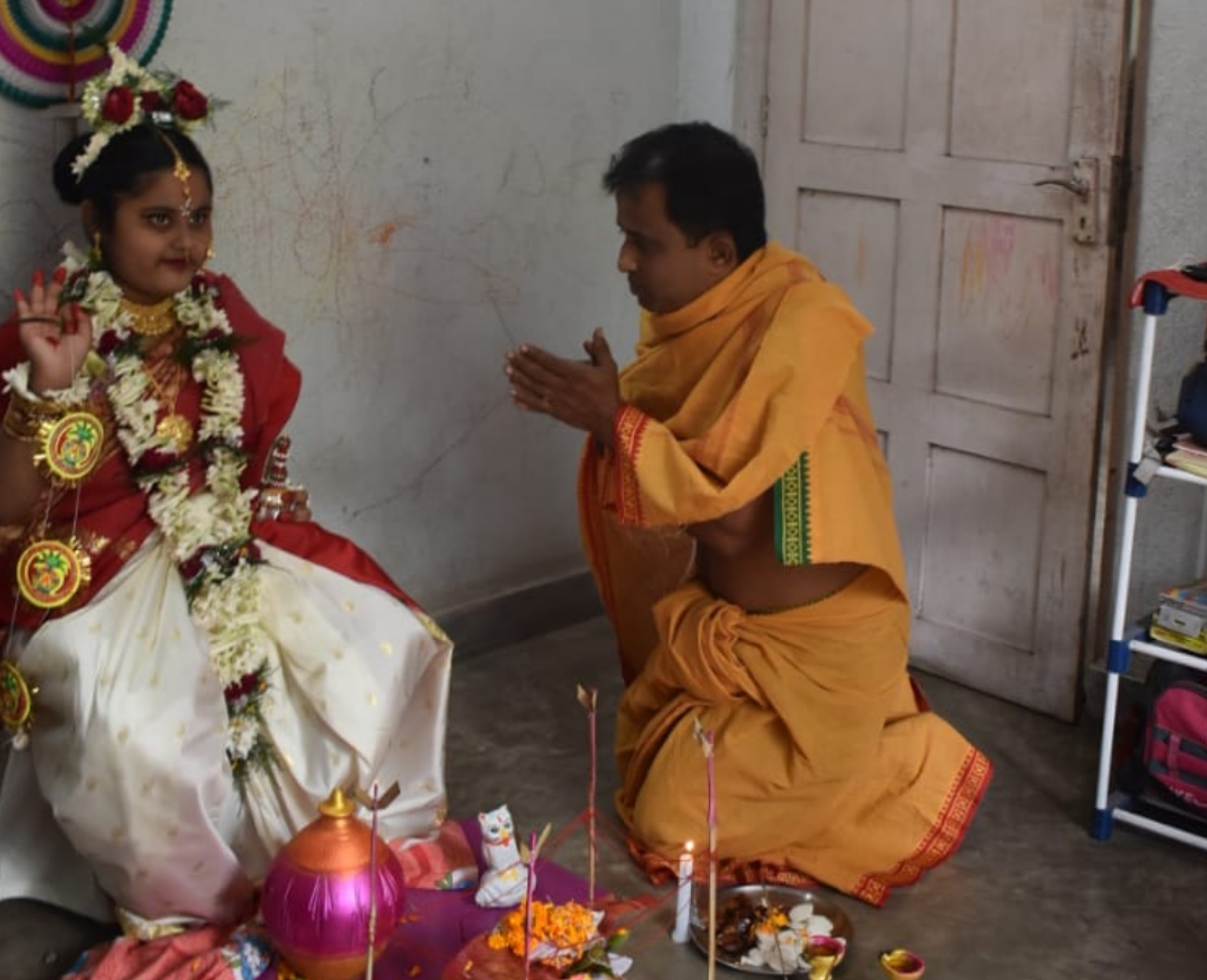 father worships his daughter as devi Lakshmi at Gobardanga