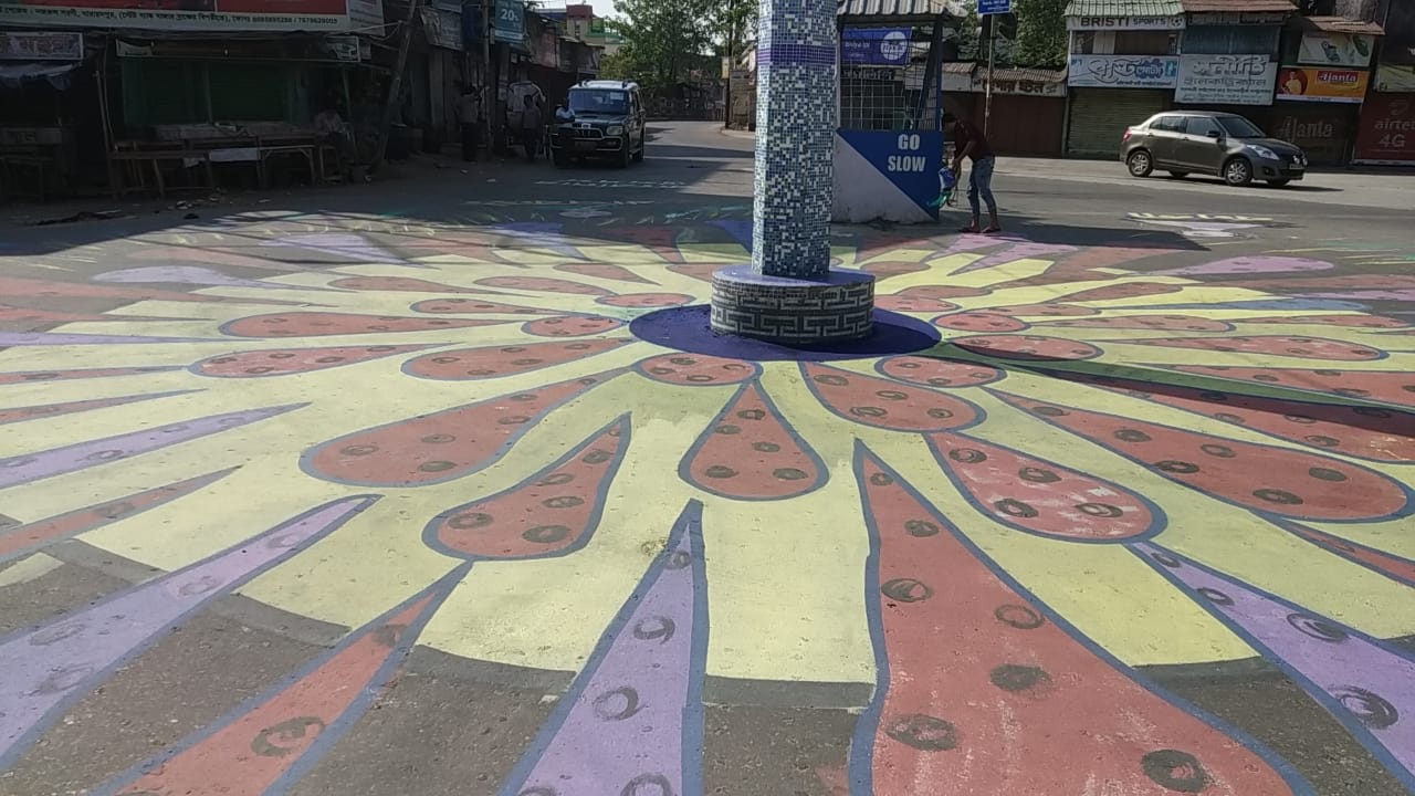 corona awareness words are painted on roads in balurghat , south dinajpur