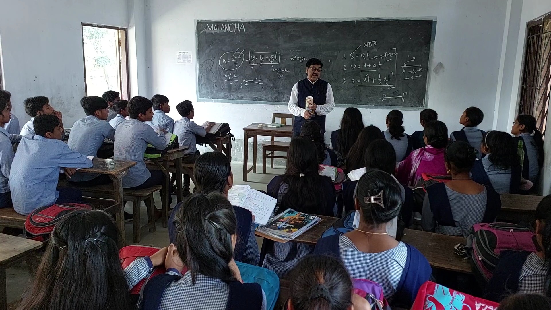 Raiganj University Registrar conducts classes in School on his weekly off