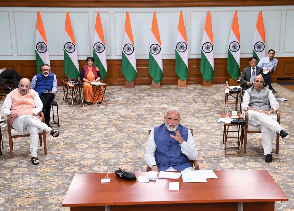 Prime Minister Narendra Modi, other ministers, speak to chief ministers of states while following social distancing norms.