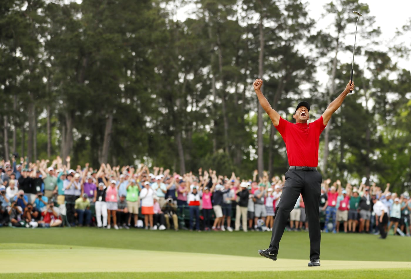 Tiger Woods celebrates after clinching his 15th major.