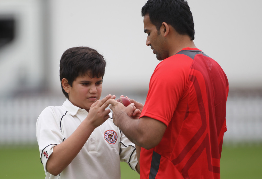 A teenage Arjun Tendulkar learning how to grip the ball from Indian bowling legend Zaheer Khan, who is now the Director of Cricket Operations at Mumbai Indians.